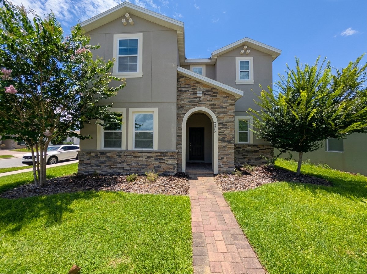 Two-story stucco-and-stone front facade at 2275 Abilia Aly, Apopka