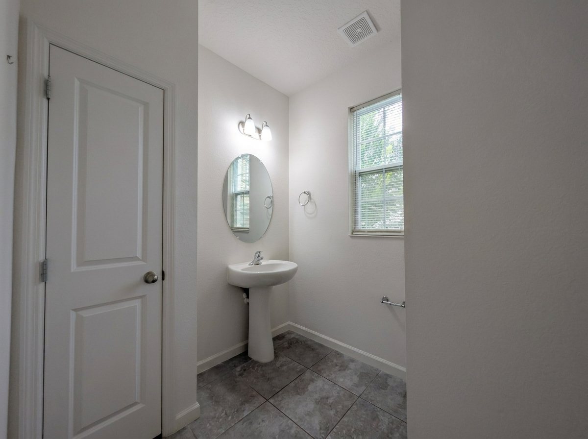 Powder room with a pedestal sink at 2275 Abilia Aly, Apopka